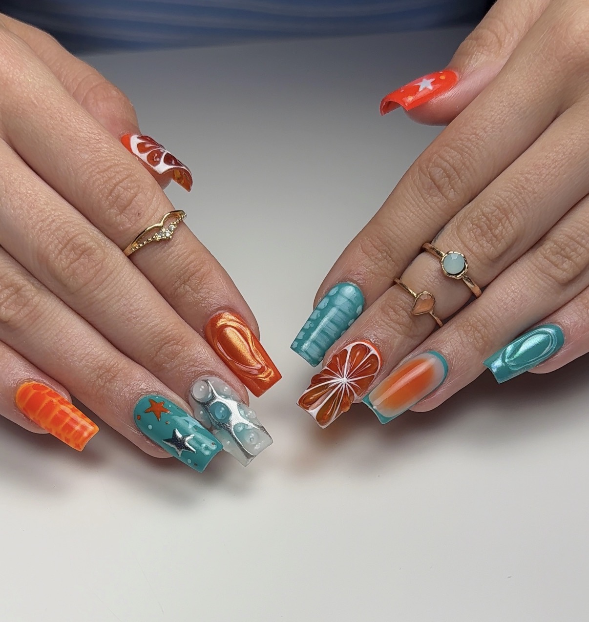 Colorful orange and turquoise nail art by Jazmine of Amethyst Nailz