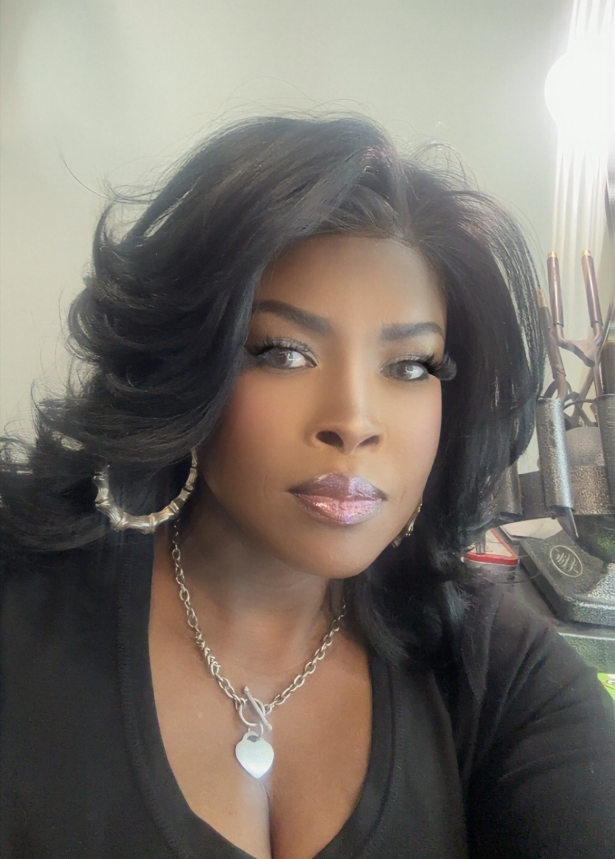 Tange, hairstylist and owner of All About Hair Ahh Salon in Suite 4